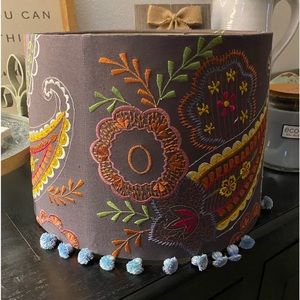 Beautiful embroidered lampshade with light blue/white tassels.